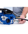 Badass Cordless Airless Paint Sprayer With Instant Electric Trigger for smooth application and heavy duty performance, showing connection detail.