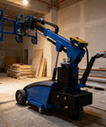 Electric Glass Vacuum Lifter Handles Heavy Stone And Metal Panels With Top Shelf Grip and Slick Mechanics Works Like A Charm For Builders Who Want Zero Hassle Relocating Slabs While Nailing Exact Placement On Every Jobsite - blue motorized lifter in a construction environment.