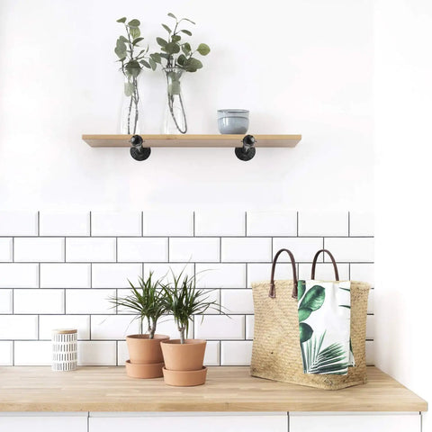 Hella Sturdy Half Inch Industrial Black Iron Pipe Shelf Brackets Legit Rustic Wall Mounted Heavy Duty decor with wood shelf and plants.
