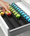 Hand inserting pod into Easy-Access Drawer Style Coffee Pod Organizer For Countertop Fits Nespresso Vertuo Capsules VertuoLine