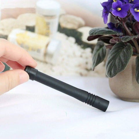 Person holding 10Pcs UHF Stubby Antenna 400-470MHz for VX Series Handheld Radios, 3.7 inch SMA Male Connector, in hand.