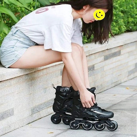 Person wearing Outdoor Black Inline Skates For Adults And Kids with durable wheels, sitting on a bench, size US 11.