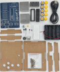 Components of Build Your Own Retro Game Rig 4-In-1 Soldering Practice Kit with LED Matrix Display, including circuit board and buttons.
