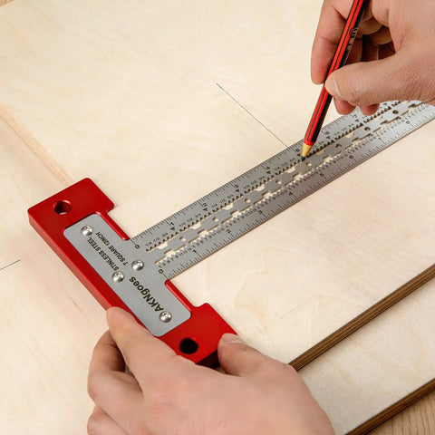 Heavy Duty Scriber T Square Ruler With Support Lips And Built In Scribe Notches Crafted From Rock Solid 301 Stainless Steel Plus Sturdy Aluminum Handle To Nail Every Carpenter Layout Job And Architectural Plan 12 Inch being used to mark lines on wood.