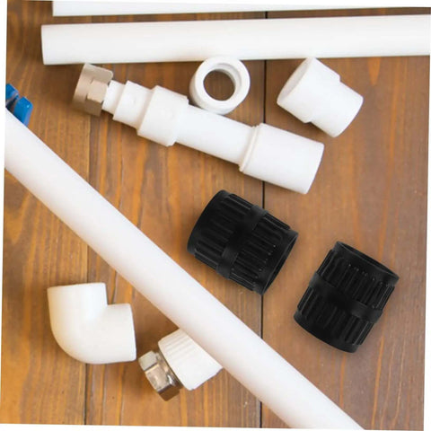 Top view of Tubing Deburring Reamer Set 2 Pcs Inner Outer Reamer Tool among various pipe fittings on a wooden surface.