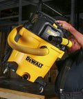 No Bull Heavy Duty 16 Gallon Wet Dry Shop Vacuum With 6.5 Peak Horsepower And 116 Cfm Airflow being lifted for use.