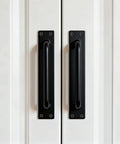 Beefy 12 Inch Heavy Duty Steel Barn Door Handles Black Powder Coat 2 Pack installed on white door