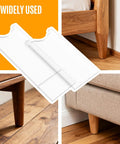 Clear Acrylic Couch Wall Spacer And Bed Blocker Stops Furniture Scrapes Keeps Heaters Cool Preserves Outlet Access Built Tough No Sweat Setup Invisible Wall Guard Anti Scratch Two Pack shown on furniture leg and wall.