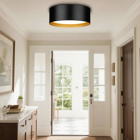 Two Light Frosted Glass Flush Mount Ceiling Light In Black With Gold Inner Accent installed in airy hallway.