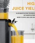 Kiamith 300W Cold Press Juicer With Huge 5.8 Inch Wide Feed Chute For Whole Produce High Torque Masticating Slow Speed Extractor pouring fresh juice into a glass.