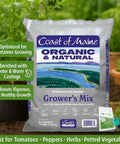Bag of Coast of Maine Grower's Mix with text highlighting benefits and features, plants in background, claw gardening gloves visible