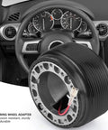 Beefy Aluminum 0.6 Inch 6 Bolt Quick Release Steering Wheel Hub Adapter for aftermarket wheels in a car interior view