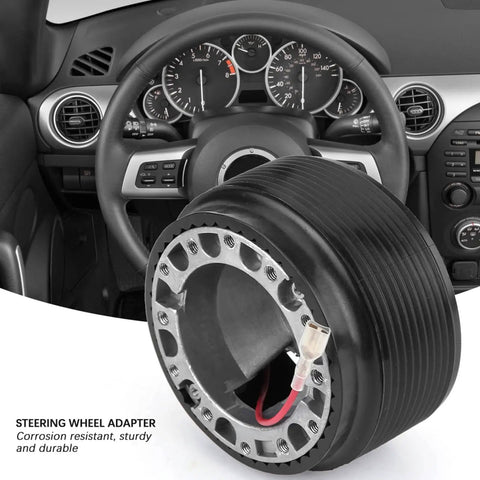 Beefy Aluminum 0.6 Inch 6 Bolt Quick Release Steering Wheel Hub Adapter for aftermarket wheels in a car interior view