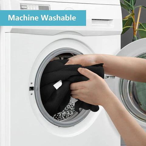 Person placing Premium Microfiber Cleaning Cloths 150 Pack 11.5 By 11.5 Inches into washing machine