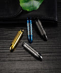 Gold Bullet Pendant Necklace With Engraved Cross And Bible Charm Premium Stainless Steel Unisex Jewelry on a wooden surface.