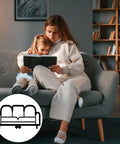 Mother and daughter reading on a grey couch, showcasing the need for 20 Pcs Heavy Duty Nylon Sectional Connectors Keep Your Couch Locked Down Tight Universal Sofa Brackets Stop Shifting And Gaps Super Easy Tool Free Install For Any Living Room Setup.