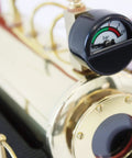 Close-up of D21 Steam Engine Model With Esbit Dry Fuel Burner TÜV Certified with gauge on metallic finish.