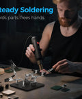 Man using Helping Hands Soldering Station with Rock Solid 3.9 Inch Base and four flexible magnetic arms for electronics work.