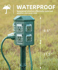 Outdoor Power Stake With A 50 Foot Waterproof Extension Cord Remote Controlled Three Separate Outlet Groups And Six Grounded Outlets For Backyard Garden Patio And Outdoor Decor ETL Listed in a grassy field, showing vertical dimensions