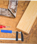 Workbench with drill, wood plank, and 4Pcs Woodworking Clamps Set For Quick Fixing And Boss Grip Heavy Duty Carpentry Clips.