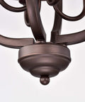 Close-up of Farmhouse Vibe 4 Light Pendant Chandelier in oil rubbed bronze with chain detail, rustic style for kitchen island.