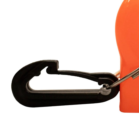 Close-up of black clip attached to bright orange diving mouthpiece cover for regulator, silicone shield to protect mouthpiece.