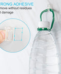 100 Pack Clear Cable Clips For Wires On Wall With Super Sticky Adhesive Easy Peel Cord Organizers holding a water bottle