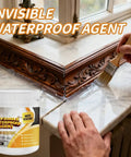 Applying invisible waterproof agent on window ledge using brush next to product container