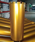 DaduoRi 8-inch diamond core drill bit standing upright; gold metal cylinder with toothed top for concrete cores.