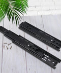 Seven Pair Eight Inch Black Soft Close Drawer Slides Heavy Duty Steel Ball Bearing Gliders with screws on wooden background.