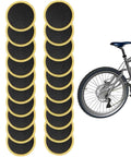 30 Pack Self Adhesive Glueless Bicycle Tire Repair Patches For Road And Mountain Bikes Black Durable Patch Kit shown with a mountain bike