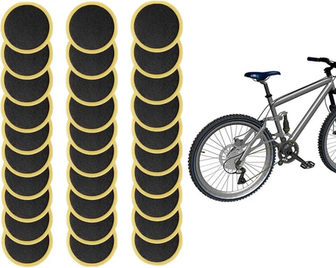 30 Pack Self Adhesive Glueless Bicycle Tire Repair Patches For Road And Mountain Bikes Black Durable Patch Kit shown with a mountain bike