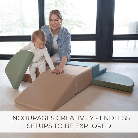 Toddler Tested Indoor Play Arena Featuring Super Soft Foam Climb Blocks Reconfigurable Crawl Tunnel Triangles And Steps Rock Solid Setup For Growing Little Legends with a child and adult playing on soft foam shapes.