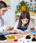 Child using Three Pack Circle Punches Set For Paper Crafts 1.5 Inch, 1 Inch, And 0.6 Inch Round Hole Punches in craft activity