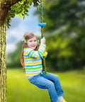 Child playing on a kid friendly outdoor swing set with disc seat climbing rope and platform heavy duty tree swing kit in a backyard.