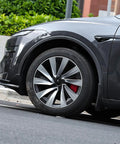 Ride Ready 4 Piece Wheel Covers For Tesla Model Y Juniper 19 Inch on sleek black and silver wheel, enhancing rim protection.