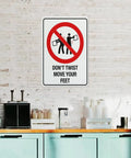 Dont Twist Move Your Feet Safety Instruction Sign 8x12 Aluminum on brick wall in kitchen setting