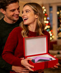 Couple smiling with Heavy Duty Cordless Electric Scissors With A Badass 10000 Rpm Blade Assembly in a red gift box.
