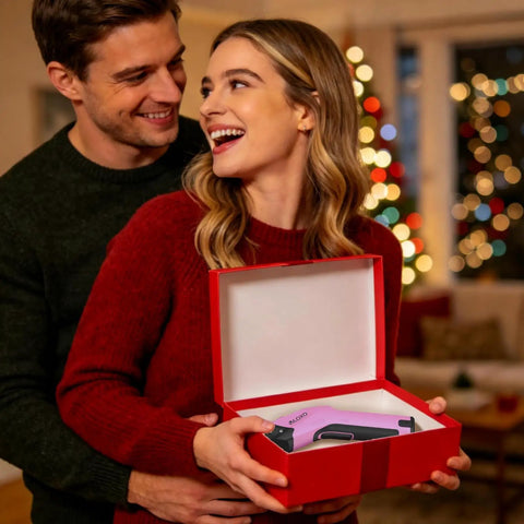 Couple smiling with Heavy Duty Cordless Electric Scissors With A Badass 10000 Rpm Blade Assembly in a red gift box.