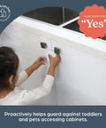 Child interacting with Flexi Lock Cabinet And Drawer Locks With Multi Touch Release System White 2 Pack No Brainer Kid Proofing