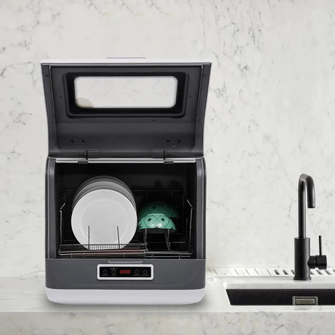 Compact Portable Countertop Dishwasher Featuring Three Wash Cycles and a Straight Up No Install Faucet Setup, showing plates inside.