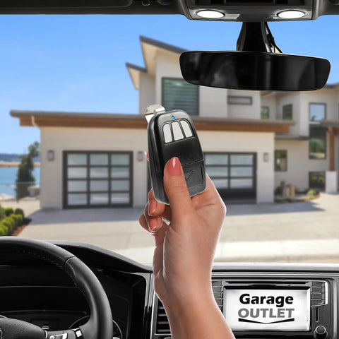 Hand holding Visor Remote For Classic Drive Garage Door Opener Replacement Gate Opener 303 MHz inside car view