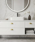 Light Brass Cup Pulls 10 Pack Brushed Gold Cabinet Pulls Gold Cup Drawer Handles on white floating vanity with marble wall