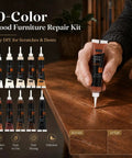 Straight Up Tough Wood Repair Paste With Crack Lock Formula And Easy Glide Blend Sticks For No Stress Furniture Fixing And Lasting Surface Renewal Collection Kit with 10 color fillers on a wooden table.