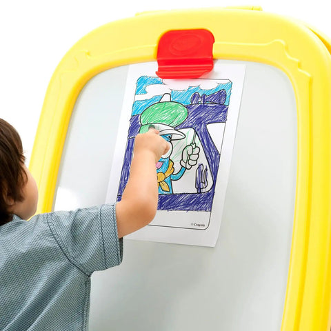 Child drawing on paper attached to Mega Size Magnetic Double Sided Kids Easel Built Tough For Endless Creative Sessions.