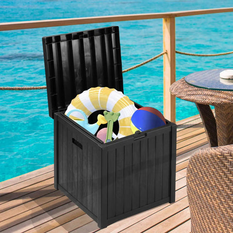 51 Gallon Patio Deck Box With Soft Close Lid, Weather Resistant Outdoor Storage Container by a pool