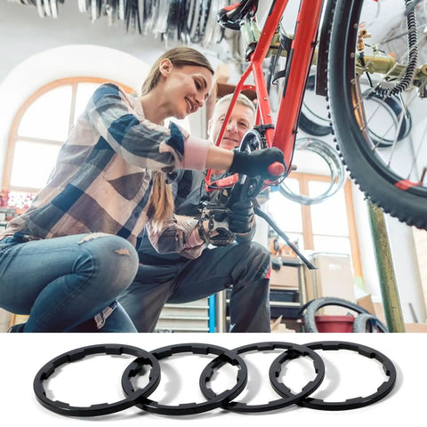 Woman and man adjusting a bike with Eight Piece Bike Headset Spacers Set For Road And Mountain Bikes Aluminum Alloy Washers