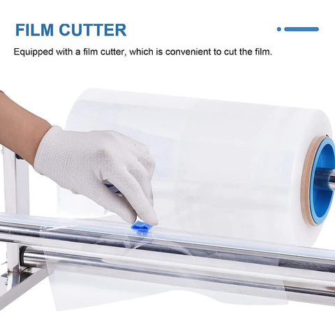 Gloved hand using stainless steel tabletop stretch film dispenser with film slide cutter for clean cuts in kitchens or shops.