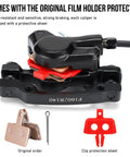 TOBWOLF hydraulic MTB disc brake kit front view; black aluminum caliper with 160mm rotors, red pad spacers and copper pads