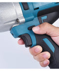 Hand gripping the Gangsud Cordless Brushless Impact Wrench, featuring a blue and black design, showing control switch for heavy duty work.